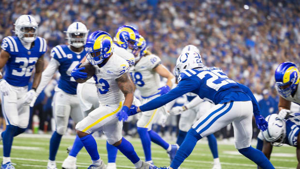 Los Angeles Rams running back Kyren Williams (23) runs for a touchdown while Indianapolis Colts safety Rodney Thomas II (25) defends in the first quarter at Lucas Oil Stadium.